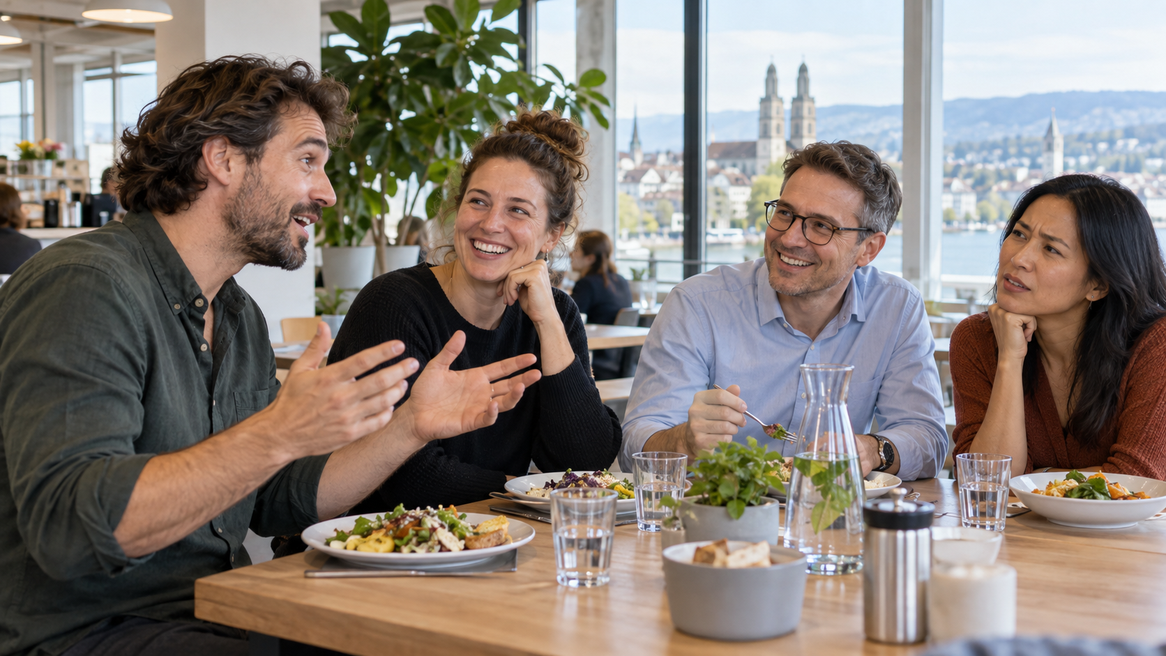 Four colleagues chatting over lunch at work